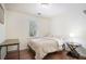 Bedroom with natural light, hardwood floors and a table for convenience at 3012 Dempsey Pl, Lawrenceville, GA 30044
