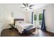 Cozy bedroom with hardwood floors, closet, and french doors leading to private balcony at 3012 Dempsey Pl, Lawrenceville, GA 30044