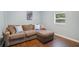 Comfortable living room with hardwood floors and large sectional sofa at 3012 Dempsey Pl, Lawrenceville, GA 30044