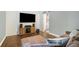 Comfortable living room with a large TV and modern entertainment setup at 3012 Dempsey Pl, Lawrenceville, GA 30044