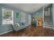 Stylish living area showcasing hardwood floors, and a neutral color palette perfect for relaxation at 3012 Dempsey Pl, Lawrenceville, GA 30044