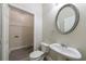 Powder room with a toilet, sink, and door that leads to a small closet for laundry at 3135 Washington Rd, Atlanta, GA 30344