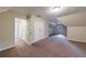 Large bedroom featuring neutral walls, carpet, and windows offering views of the outside at 3135 Washington Rd, Atlanta, GA 30344