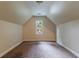 The bedroom has carpeted floors, neutral walls, and a window that provides outside views at 3135 Washington Rd, Atlanta, GA 30344