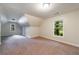 Large bedroom featuring neutral walls, carpet, and windows offering views of the outside at 3135 Washington Rd, Atlanta, GA 30344