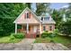 Charming home with a welcoming front porch and well-maintained landscaping at 3135 Washington Rd, Atlanta, GA 30344
