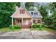 Charming home with a welcoming front porch and well-maintained landscaping at 3135 Washington Rd, Atlanta, GA 30344