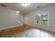 Bright living room featuring hardwood floors, staircase, and natural light at 3135 Washington Rd, Atlanta, GA 30344