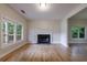 Bright living room featuring hardwood floors and a fireplace at 3135 Washington Rd, Atlanta, GA 30344
