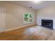 Cozy living room featuring hardwood floors and fireplace at 3135 Washington Rd, Atlanta, GA 30344