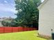 Large backyard with a well-maintained lawn and a privacy fence at 4424 High Gate Nw Dr, Acworth, GA 30101