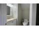Compact powder room with a vanity and toilet at 4424 High Gate Nw Dr, Acworth, GA 30101