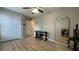 Multipurpose bedroom space with closet, piano, large mirror, wood flooring, and natural light at 4424 High Gate Nw Dr, Acworth, GA 30101