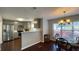 Open kitchen and dining area features stainless steel appliances and stylish gray cabinetry at 4424 High Gate Nw Dr, Acworth, GA 30101