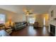 Spacious living room boasts hardwood floors, a ceiling fan, and an archway to the dining area at 4424 High Gate Nw Dr, Acworth, GA 30101