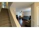 View of the neutrally painted living room featuring wood floors, comfortable seating, and a ceiling fan at 4424 High Gate Nw Dr, Acworth, GA 30101