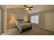 Spacious bedroom with vaulted ceiling, fan, neutral colors, and bedside tables with lamps at 4424 High Gate Nw Dr, Acworth, GA 30101