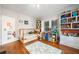 Bright bedroom with hardwood floors, built-in bookcases and bunkbed, creating a cozy and functional space at 451 S Columbia Dr, Decatur, GA 30030