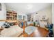Bright bedroom with hardwood floors and built-in shelves showcasing toys and books at 451 S Columbia Dr, Decatur, GA 30030