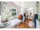 Bright dining room with hardwood floors, white table, and plants, creating a welcoming atmosphere at 451 S Columbia Dr, Decatur, GA 30030