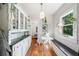 Bright dining area with built-in cabinets, hardwood floors, and large windows, creating a charming space at 451 S Columbia Dr, Decatur, GA 30030