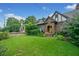 Beautifully landscaped front yard with a classic brick home featuring a bright, welcoming entrance at 451 S Columbia Dr, Decatur, GA 30030