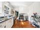 Bright kitchen with white cabinets, stainless steel appliances, and hardwood floors, with natural light at 451 S Columbia Dr, Decatur, GA 30030