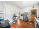 Kitchen featuring white cabinets, stainless steel appliances, and hardwood floors at 451 S Columbia Dr, Decatur, GA 30030