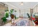 Charming sun room with brick walls, tiled floors, and abundant natural light, perfect for relaxation at 451 S Columbia Dr, Decatur, GA 30030