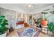 Bright sun room with brick walls, tile floor, and large windows letting in natural light at 451 S Columbia Dr, Decatur, GA 30030