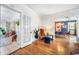 Bright sun room with tiled floors, whitewashed brick, and lush greenery creating a serene retreat at 451 S Columbia Dr, Decatur, GA 30030