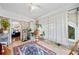 Bright sun room with brick walls, tile floor, and large windows letting in natural light at 451 S Columbia Dr, Decatur, GA 30030