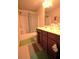 Functional bathroom featuring a tub, shower, toilet, and a dark wood vanity with sink at 560 Tuscany Walk Ln, Lawrenceville, GA 30043
