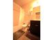 Cozy bathroom with dark cabinetry, toilet, and shower-tub combo with shower curtain at 560 Tuscany Walk Ln, Lawrenceville, GA 30043