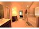 Primary bath with double sinks, separate glass shower and soaking tub at 560 Tuscany Walk Ln, Lawrenceville, GA 30043