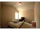 Cozy bedroom with neutral walls, carpet, a window, and a basic bed setup at 560 Tuscany Walk Ln, Lawrenceville, GA 30043