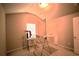 Simple bedroom with neutral walls, carpet, a window, and a clothes drying rack at 560 Tuscany Walk Ln, Lawrenceville, GA 30043