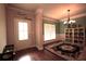 Cozy dining room with hardwood floors, stylish chandelier, and decorative wall art at 560 Tuscany Walk Ln, Lawrenceville, GA 30043