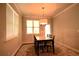 Bright dining room with large windows and an elegant chandelier at 560 Tuscany Walk Ln, Lawrenceville, GA 30043