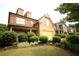 Attractive two-story home with brick and siding facade, complemented by lush landscaping at 560 Tuscany Walk Ln, Lawrenceville, GA 30043