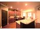 Well-equipped kitchen features granite countertops and stainless steel appliances at 560 Tuscany Walk Ln, Lawrenceville, GA 30043