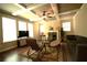 Open-concept living room features coffered ceilings and a cozy fireplace at 560 Tuscany Walk Ln, Lawrenceville, GA 30043