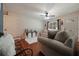 Cozy living room with hardwood floors, neutral furniture, ceiling fan, and lots of natural light at 57 Jonathan Rd, Riverdale, GA 30274