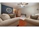 Inviting living room with hardwood floors, comfortable seating, and views into the kitchen and dining area at 57 Jonathan Rd, Riverdale, GA 30274