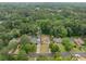 This aerial view highlights the home's spacious lot and location in a neighborhood with mature trees at 2123 Drew Valley Ne Rd, Brookhaven, GA 30319