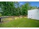 A backyard featuring a deck with green turf and wooden railing, perfect for relaxing and entertaining outdoors at 2123 Drew Valley Ne Rd, Brookhaven, GA 30319