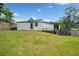 Expansive backyard with a well-maintained lawn and a wooden deck, perfect for outdoor gatherings at 2123 Drew Valley Ne Rd, Brookhaven, GA 30319