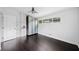 A minimalist bedroom with dark floors, a ceiling fan, and a built-in wardrobe at 2123 Drew Valley Ne Rd, Brookhaven, GA 30319