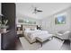 Bright bedroom boasts neutral tones, ceiling fan, and windows for natural light at 2123 Drew Valley Ne Rd, Brookhaven, GA 30319