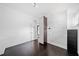 Bedroom featuring minimalist decor, dark wood floor, and interesting wallpaper at 2123 Drew Valley Ne Rd, Brookhaven, GA 30319